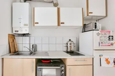 Cuisine ou kitchenette dans l'établissement Appart confort moderne près Montmartre