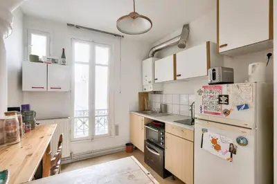 Cuisine ou kitchenette dans l'établissement Appart confort moderne près Montmartre