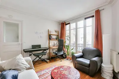 Coin salon dans l'établissement Appart confort moderne près Montmartre