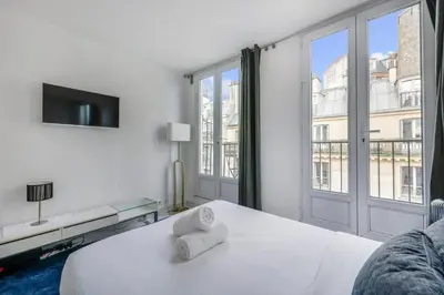 Un ou plusieurs lits dans un hébergement de l'établissement My Parisian Terrasse