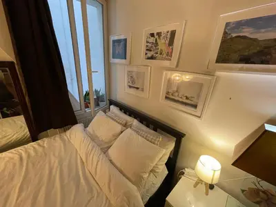 Un ou plusieurs lits dans un hébergement de l'établissement Appartement Paris arrondissement 10