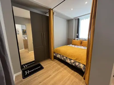 Un ou plusieurs lits dans un hébergement de l'établissement Appartement
