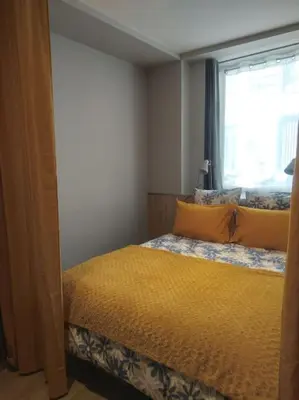 Un ou plusieurs lits dans un hébergement de l'établissement Appartement