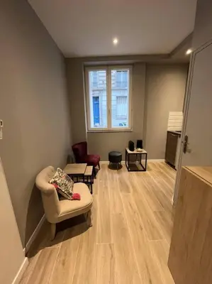 Coin salon dans l'établissement Appartement