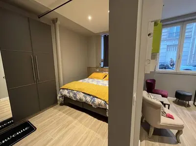 Un ou plusieurs lits dans un hébergement de l'établissement Appartement
