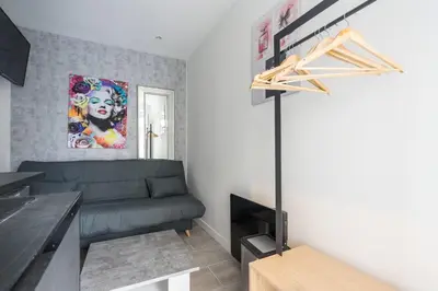 Coin salon dans l'établissement Cozy studio in the heart of Paris