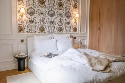 Un ou plusieurs lits dans un hébergement de l'établissement Appart Haussmannien luxe - 2 chambres, Champs-Élysées