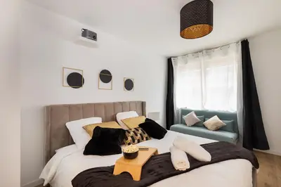 Un ou plusieurs lits dans un hébergement de l'établissement Suite de Luxe à 10 min de Paris - Sauna, Cinéma