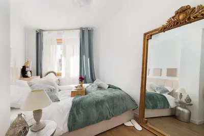 Un ou plusieurs lits dans un hébergement de l'établissement Suite de Luxe à 10 min de Paris - Sauna, Cinéma