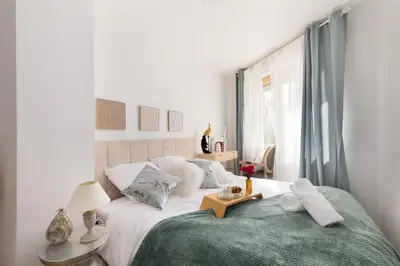 Un ou plusieurs lits dans un hébergement de l'établissement Suite de Luxe à 10 min de Paris - Sauna, Cinéma