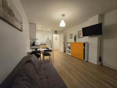Télévision ou salle de divertissement dans l'établissement Appartement centre de Paris 19