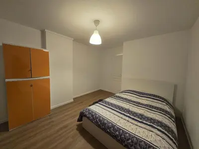 Un ou plusieurs lits dans un hébergement de l'établissement Appartement centre de Paris 19