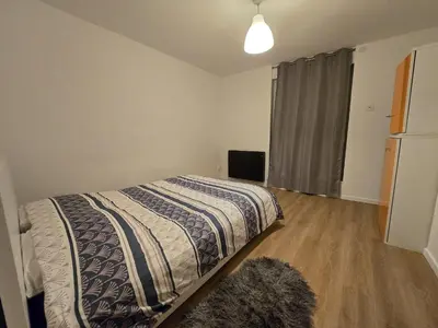 Un ou plusieurs lits dans un hébergement de l'établissement Appartement centre de Paris 19