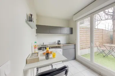 Cuisine ou kitchenette dans l'établissement Le Haven Stade de France renty
