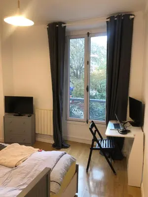 Télévision ou salle de divertissement dans l'établissement Le Studio du Square