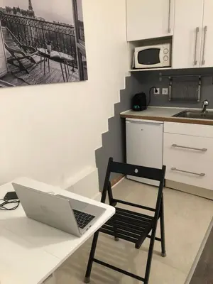 Cuisine ou kitchenette dans l'établissement Le Studio du Square