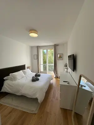 Un ou plusieurs lits dans un hébergement de l'établissement Appartement Trocadéro
