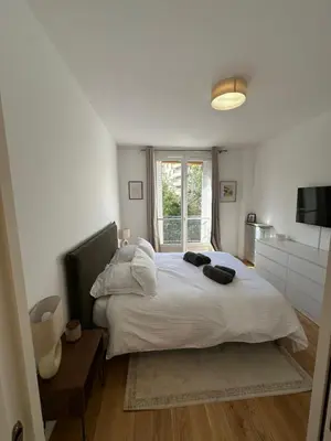 Un ou plusieurs lits dans un hébergement de l'établissement Appartement Trocadéro