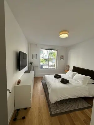 Un ou plusieurs lits dans un hébergement de l'établissement Appartement Trocadéro