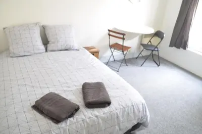 Un ou plusieurs lits dans un hébergement de l'établissement Studio Paris 18