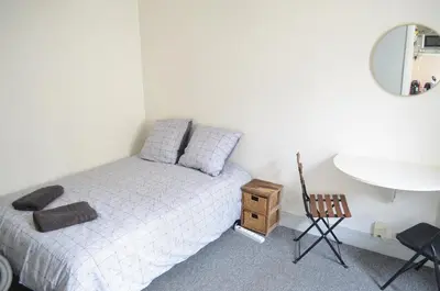 Un ou plusieurs lits dans un hébergement de l'établissement Studio Paris 18