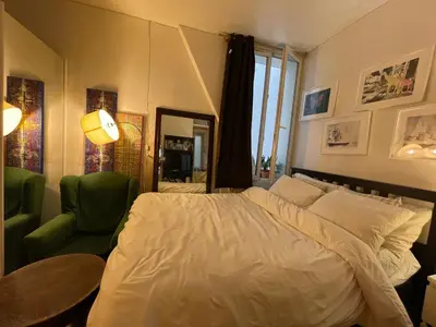 Un ou plusieurs lits dans un hébergement de l'établissement Appartement meublé Paris 10e arrondissement