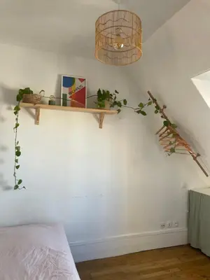 Un ou plusieurs lits dans un hébergement de l'établissement Petit appartement parisien