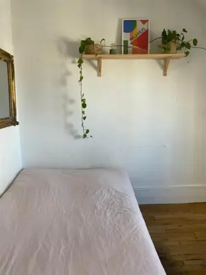 Un ou plusieurs lits dans un hébergement de l'établissement Petit appartement parisien