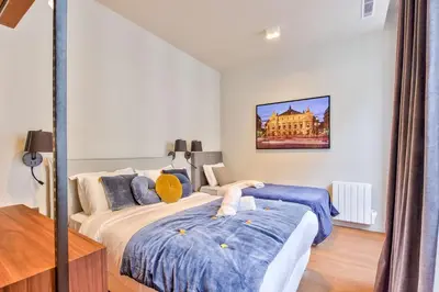 Un ou plusieurs lits dans un hébergement de l'établissement Urban Flat 111 - Urban Lovely Flat Madeleine