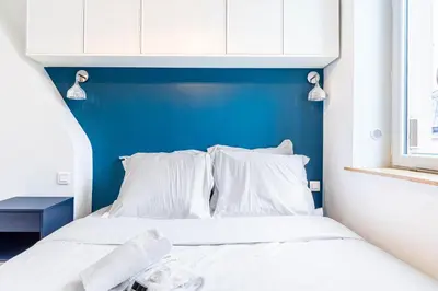 Un ou plusieurs lits dans un hébergement de l'établissement Guestready - Tastefully decorated studio for 2