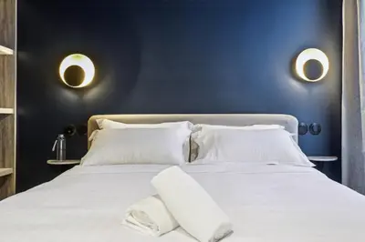 Un ou plusieurs lits dans un hébergement de l'établissement Hôtel Clémence