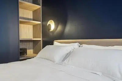 Un ou plusieurs lits dans un hébergement de l'établissement Hôtel Clémence