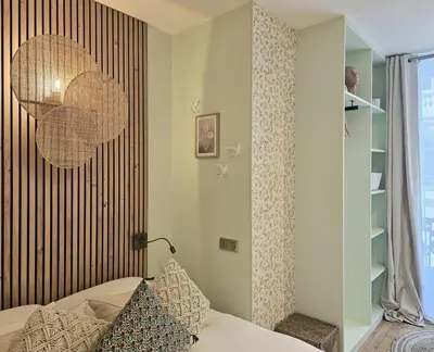 Un ou plusieurs lits dans un hébergement de l'établissement Chic Apartment By Capucine - Grands Magasins