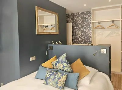 Un ou plusieurs lits dans un hébergement de l'établissement Chic Apartment By Capucine - Grands Magasins