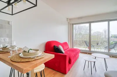 Coin salon dans l'établissement Appartement Luxueux Cosy - Paris Expo