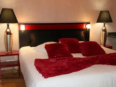 Un ou plusieurs lits dans un hébergement de l'établissement Marinha Hôtel