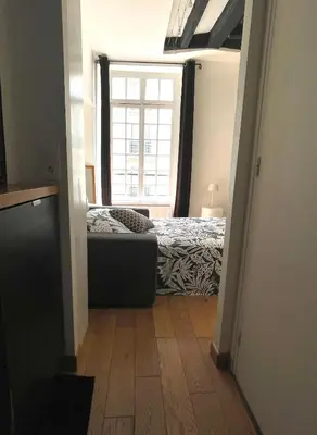 Un ou plusieurs lits dans un hébergement de l'établissement Mini studio au cœur du Marais