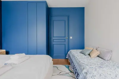 Un ou plusieurs lits dans un hébergement de l'établissement Luxurious apartment - 4BR-10P- Ternes-Pereire