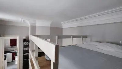 Un ou plusieurs lits dans un hébergement de l'établissement Paris 16 Studio Near Arc de Triomphe and Eiffel Tower