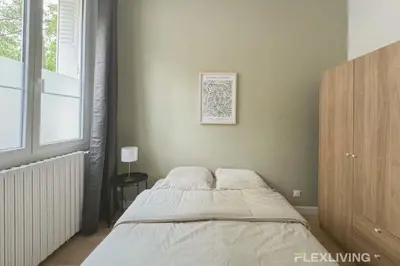 Un ou plusieurs lits dans un hébergement de l'établissement Flexliving - 99 Felix Faure - Room