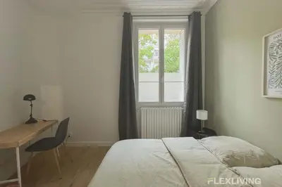 Un ou plusieurs lits dans un hébergement de l'établissement Flexliving - 99 Felix Faure - Room
