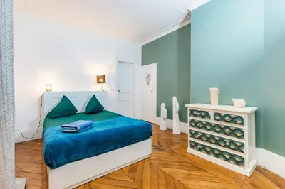 Un ou plusieurs lits dans un hébergement de l'établissement Top Appartement Avenue Ternes Paris
