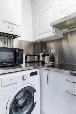 Cuisine ou kitchenette dans l'établissement Top Appartement Avenue Ternes Paris