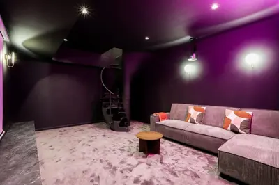 Coin salon dans l'établissement Sublime duplex avec salle de cinéma