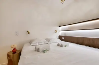 Un ou plusieurs lits dans un hébergement de l'établissement Sublime duplex avec salle de cinéma