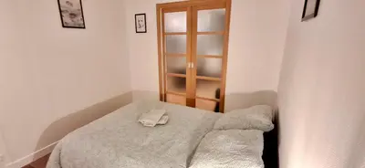 Un ou plusieurs lits dans un hébergement de l'établissement Home Sweet Home Champs Elysées Berri