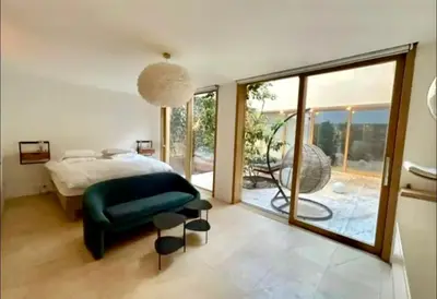 Un ou plusieurs lits dans un hébergement de l'établissement Paris Appartement avec grande terrasse