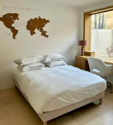 Un ou plusieurs lits dans un hébergement de l'établissement Paris Appartement avec grande terrasse