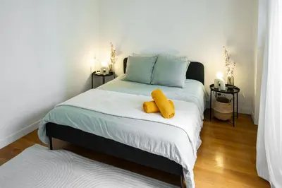 Un ou plusieurs lits dans un hébergement de l'établissement Appartement Central Les Halles