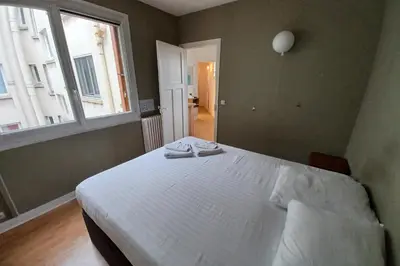 Un ou plusieurs lits dans un hébergement de l'établissement Cosy apartment with all amenities